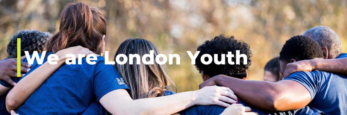 Group of young people in team huddle at London Youth